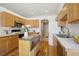 Beautiful, bright kitchen featuring wooden cabinets, modern appliances, and lots of counter space at 13959 E 106Th Ave, Commerce City, CO 80022