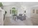Bright living room with vaulted ceilings, fireplace, and large windows offering natural light at 13959 E 106Th Ave, Commerce City, CO 80022