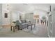 Inviting living room with vaulted ceiling, neutral color scheme, and smooth carpet at 13959 E 106Th Ave, Commerce City, CO 80022