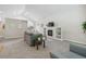 Cozy living room featuring a fireplace, TV, vaulted ceilings and a sofa at 13959 E 106Th Ave, Commerce City, CO 80022