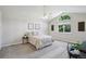 Spacious main bedroom with a large arched window and tasteful decor at 13959 E 106Th Ave, Commerce City, CO 80022