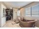 Spa-like bathroom featuring copper soaking tub, glass-enclosed shower, and walk in closet at 9545 Grand Cypress Cv, Lone Tree, CO 80124