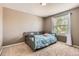 Cozy bedroom with neutral tones, a comfortable bed, and a bright window at 9545 Grand Cypress Cv, Lone Tree, CO 80124