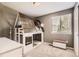 Unique bedroom featuring a custom house bed frame and ample natural light at 9545 Grand Cypress Cv, Lone Tree, CO 80124