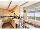 Modern kitchen featuring light wood cabinetry, stone backsplash and stainless steel appliances at 9545 Grand Cypress Cv, Lone Tree, CO 80124