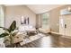 Spacious living room with vaulted ceiling, hardwood floors, and stylish decor at 9545 Grand Cypress Cv, Lone Tree, CO 80124