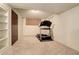 Finished basement with a treadmill and built-in shelving at 722 S Eagle St, Aurora, CO 80012