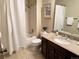 Clean bathroom with shower/tub combo and granite vanity at 722 S Eagle St, Aurora, CO 80012