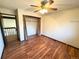 Spacious bedroom with wood-look flooring and a ceiling fan at 722 S Eagle St, Aurora, CO 80012