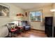 Bedroom with armchair, end table, and window seat at 722 S Eagle St, Aurora, CO 80012