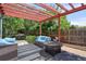 Relaxing patio with pergola, seating, and fire pit at 722 S Eagle St, Aurora, CO 80012