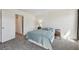 Cozy bedroom features soft carpet, neutral tones, and an ensuite bathroom at 12125 Bannock St # C, Westminster, CO 80234