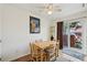 Dining room with a wooden table and chairs, and sliding glass door to the back at 12125 Bannock St # C, Westminster, CO 80234