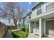 Charming, light-blue townhome with landscaped front yard and welcoming entrance at 12125 Bannock St # C, Westminster, CO 80234