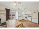 Bright kitchen featuring a dining table and a sliding glass door to the backyard at 12125 Bannock St # C, Westminster, CO 80234