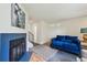 Comfortable living room with fireplace and hardwood floors leading to stairs at 12125 Bannock St # C, Westminster, CO 80234