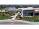Exterior view of the Venture Center clubhouse with sidewalks, landscaping, and bike racks at 148 Baler Ct, Brighton, CO 80601