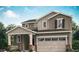 Charming two-story home with a two car garage and covered porch in a landscaped yard at 148 Baler Ct, Brighton, CO 80601