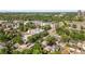 An aerial view showing a community with apartment buildings and the surrounding area with lush greenery at 2124 E 17Th Ave # 4, Denver, CO 80206