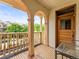 The balcony has vintage tile flooring, brick columns, and a wood railing at 2124 E 17Th Ave # 4, Denver, CO 80206