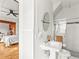 This bathroom features a pedestal sink, tile floors, and a glass shower at 2124 E 17Th Ave # 4, Denver, CO 80206