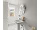 Bathroom features a vintage sink, window, and tile flooring at 2124 E 17Th Ave # 4, Denver, CO 80206