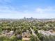 An amazing downtown city skyline view overlooking the surrounding lush tree filled landscape at 2124 E 17Th Ave # 4, Denver, CO 80206