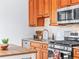 This kitchen features stainless steel appliances, granite countertops, and wood cabinets at 2124 E 17Th Ave # 4, Denver, CO 80206