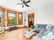 Bright living room with hardwood floors, large windows, and cozy seating at 2124 E 17Th Ave # 4, Denver, CO 80206