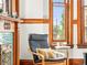 Brightly lit living room with large windows, original wood trim and stylish furniture at 2124 E 17Th Ave # 4, Denver, CO 80206