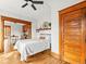 The bedroom offers wood floors, light walls, and charming wooden trim and doors at 2124 E 17Th Ave # 4, Denver, CO 80206
