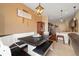 Inviting dining area adjacent to the kitchen, featuring a built-in bench and stylish lighting at 12744 Leyden St # F, Thornton, CO 80602