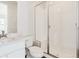 A bright bathroom featuring a glass shower and modern vanity at 13750 Emerald Lake St, Parker, CO 80138