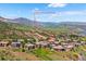 Suburban aerial view of home with rolling mountain vistas, including Red Rocks Amphitheater at 6194 Falcon Ridge Way, Morrison, CO 80465