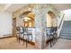 Stone bar area with seating for four and stone archways leading to other spaces at 6194 Falcon Ridge Way, Morrison, CO 80465