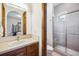 Bathroom with a single sink vanity and a separate glass enclosed walk-in shower at 6194 Falcon Ridge Way, Morrison, CO 80465