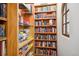 This bookcase is filled with an assortment of books and games at 6194 Falcon Ridge Way, Morrison, CO 80465