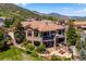 Spacious, multi-level home with a tile roof, stone accents and large decks with mountain views at 6194 Falcon Ridge Way, Morrison, CO 80465