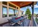 Charming outdoor patio featuring ample seating, scenic views, and a covered area, ideal for enjoying the outdoors at 6194 Falcon Ridge Way, Morrison, CO 80465