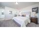 Spacious bedroom has neutral carpet, white walls, and a walk-in closet entrance at 13588 E 103Rd Pl, Commerce City, CO 80022