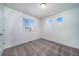 Bedroom features two windows and a window with blinds for ample natural light at 13588 E 103Rd Pl, Commerce City, CO 80022