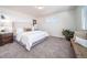 Well-lit bedroom features neutral carpet, white walls, and two windows at 13588 E 103Rd Pl, Commerce City, CO 80022