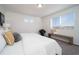 Bright bedroom featuring natural light, carpet, and stylish accents at 13588 E 103Rd Pl, Commerce City, CO 80022
