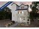 Charming new construction home with a light exterior, a balcony, and professionally landscaped front yard at 13588 E 103Rd Pl, Commerce City, CO 80022