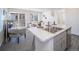 Modern kitchen featuring an island with seating and a sink, perfect for entertaining and everyday use at 13588 E 103Rd Pl, Commerce City, CO 80022