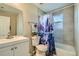 Clean bathroom, featuring a shower/tub combo, toilet and vanity at 11058 Grange Creek Dr, Thornton, CO 80233