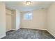 Empty bedroom with carpet and a window, ready for new occupants and furniture at 11058 Grange Creek Dr, Thornton, CO 80233