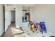 bedroom with hardwood floors and built-in shelving at 11058 Grange Creek Dr, Thornton, CO 80233