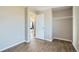 Empty bedroom featuring wood flooring and a doorway leading to another room at 11058 Grange Creek Dr, Thornton, CO 80233