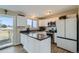 Modern kitchen with white cabinets, granite countertops, and stainless steel appliances at 11058 Grange Creek Dr, Thornton, CO 80233